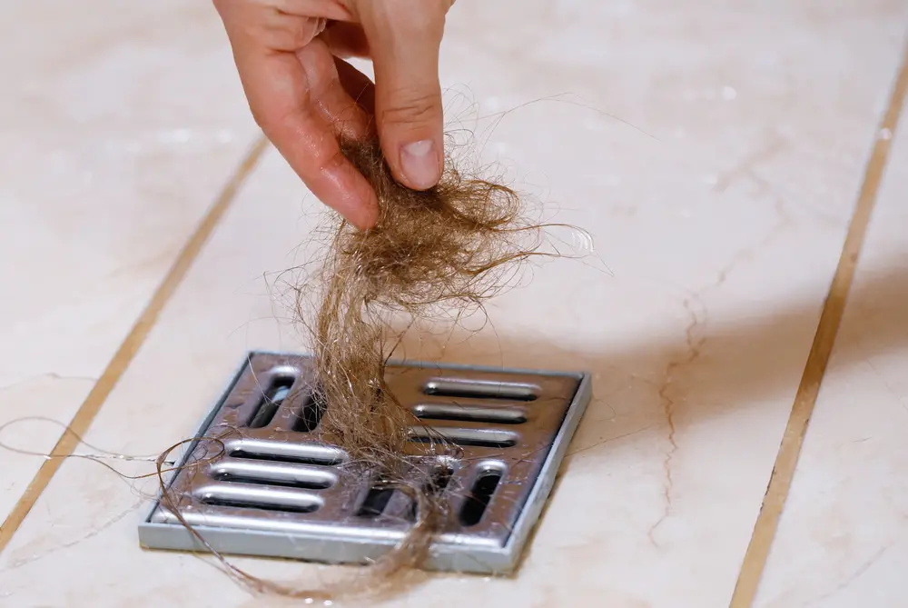 removing hair clump from shower drain