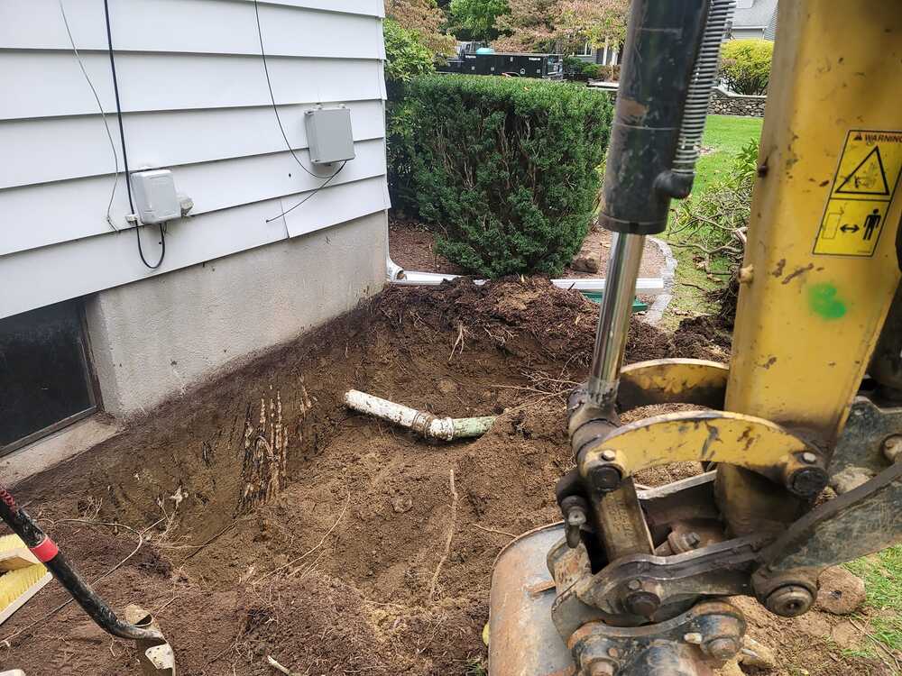 sewer line excavator and pipe installed